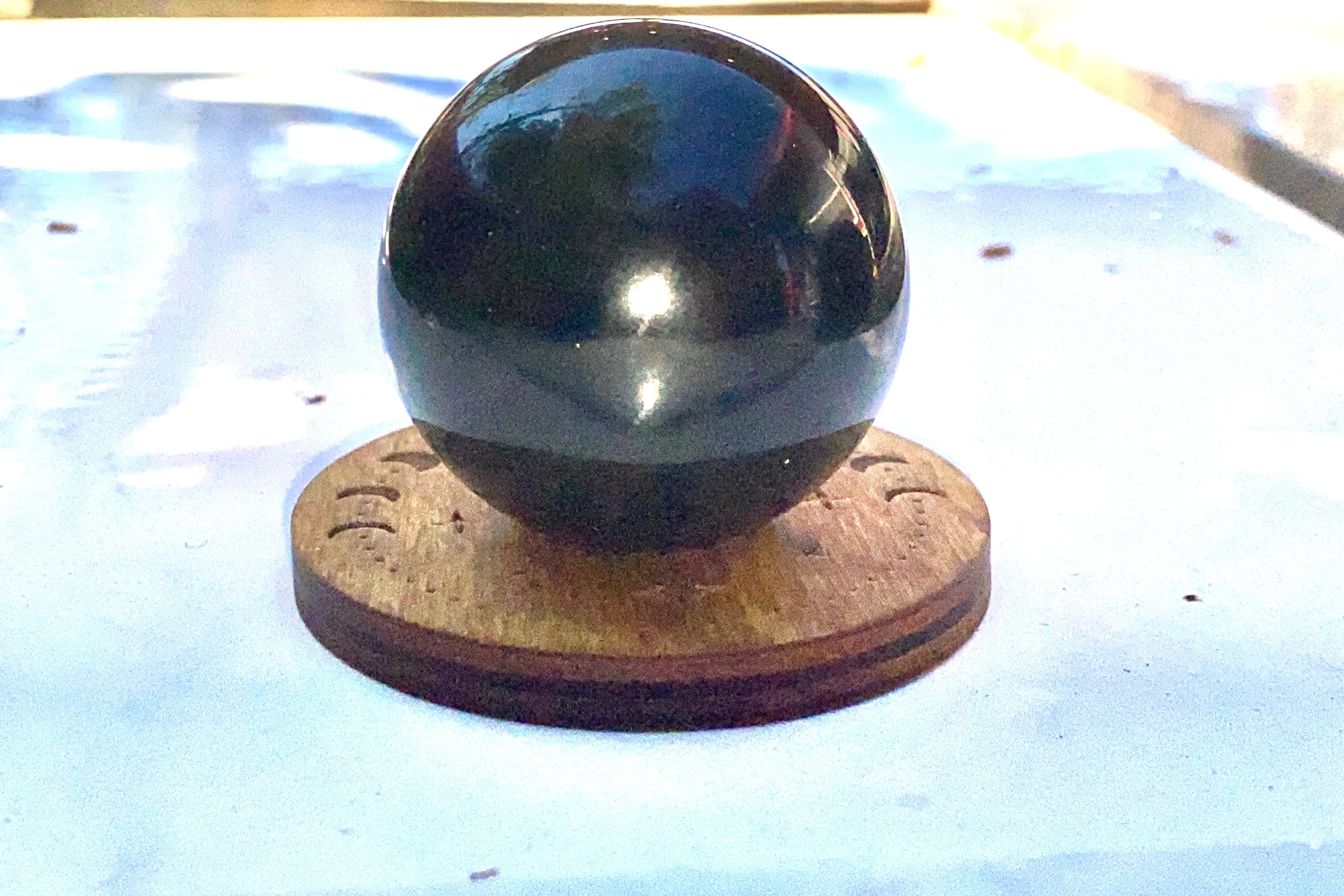 Wooden stand for gemstone sphere, crystal ball